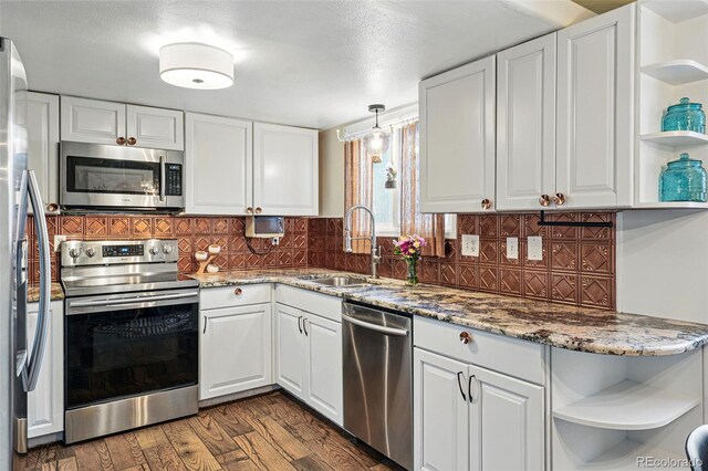 3593 S Gibralter Cir, Aurora, CO 80013 - kitchen with open shelves, appliances with stainless steel finishes, a sink, and white cabinets