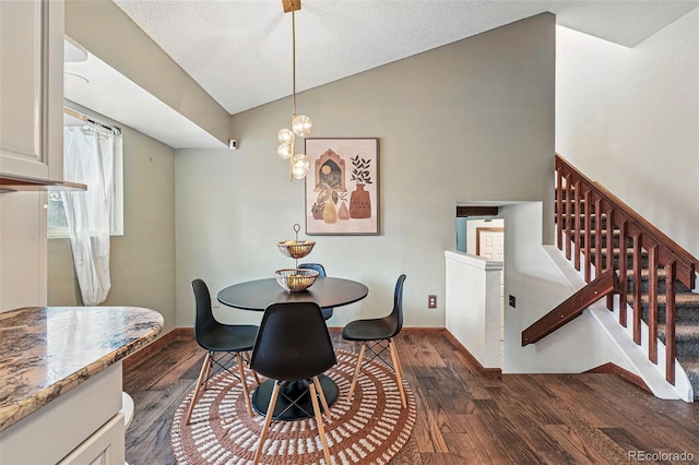3593 S Gibralter Cir, Aurora, CO 80013 - dining space with dark wood-style floors, lofted ceiling, stairs, and baseboards