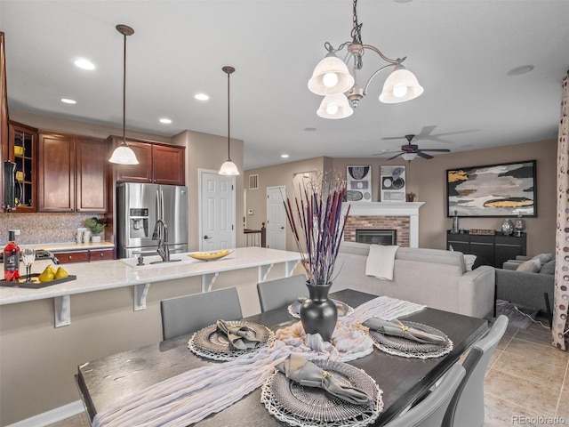 dining room featuring recessed lighting, visible vents, ceiling fan, a fireplace, and light tile patterned flooring