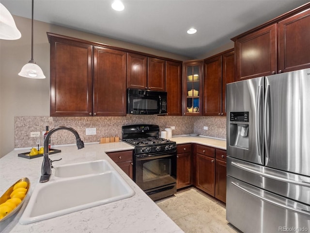 kitchen with decorative backsplash, glass insert cabinets, a sink, and black appliances