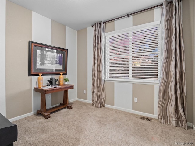 interior space featuring carpet, visible vents, and baseboards