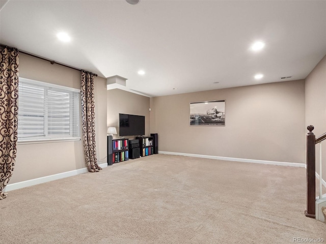 below grade area with recessed lighting, carpet flooring, and baseboards