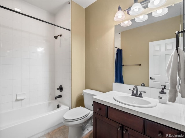 full bathroom featuring washtub / shower combination, vanity, and toilet