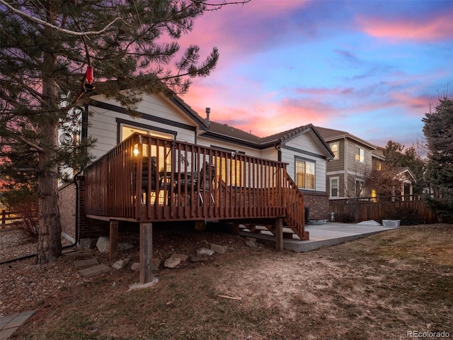 back of house featuring a patio area and a deck