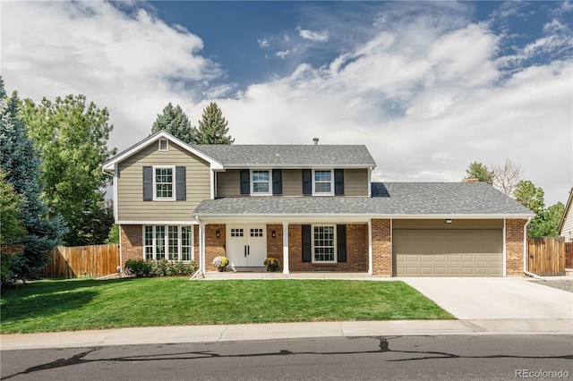 view of front of property featuring a garage and a front lawn