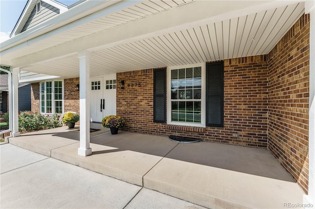 doorway to property with covered porch