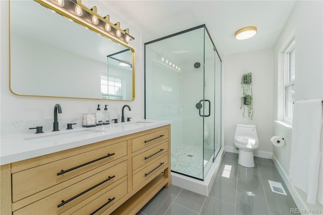 bathroom featuring vanity, a shower with shower door, tile patterned floors, and toilet