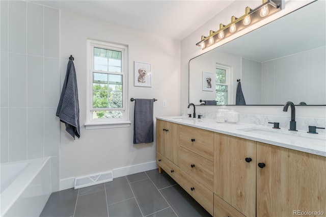 bathroom with vanity and tile patterned floors