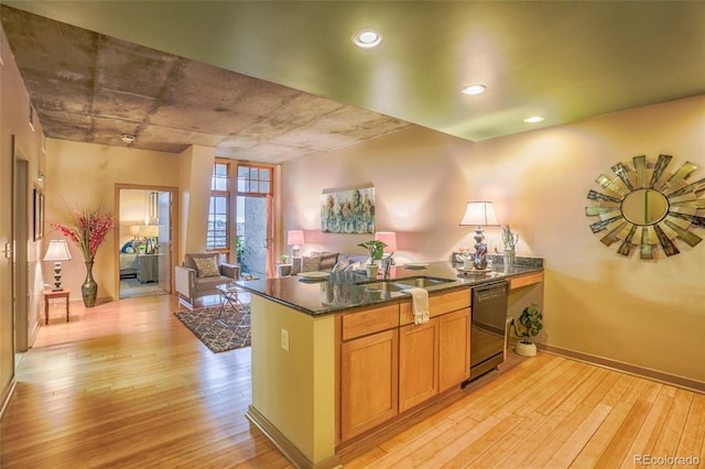 275 S Harrison St Unit 409, Denver, CO 80209 - kitchen with dishwashing machine, light wood finished floors, a peninsula, open floor plan, and recessed lighting