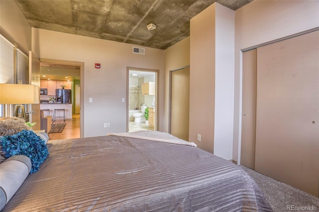 275 S Harrison St Unit 409, Denver, CO 80209 - bedroom with refrigerator with ice dispenser and ensuite bath