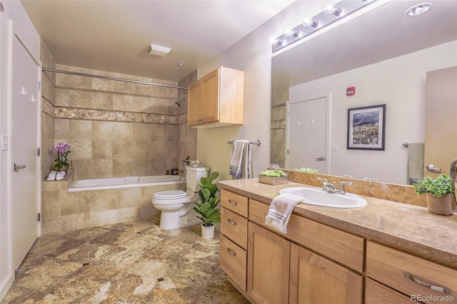 275 S Harrison St Unit 409, Denver, CO 80209 - bathroom with vanity, tiled shower / bath combo, and stone finish floors