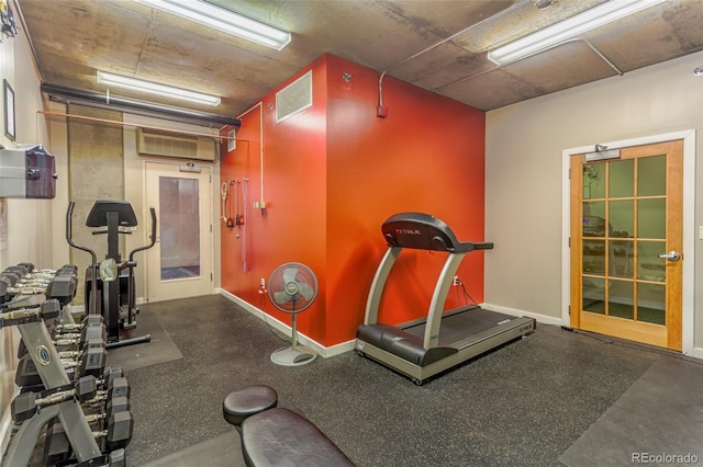 275 S Harrison St Unit 409, Denver, CO 80209 - exercise room featuring baseboards