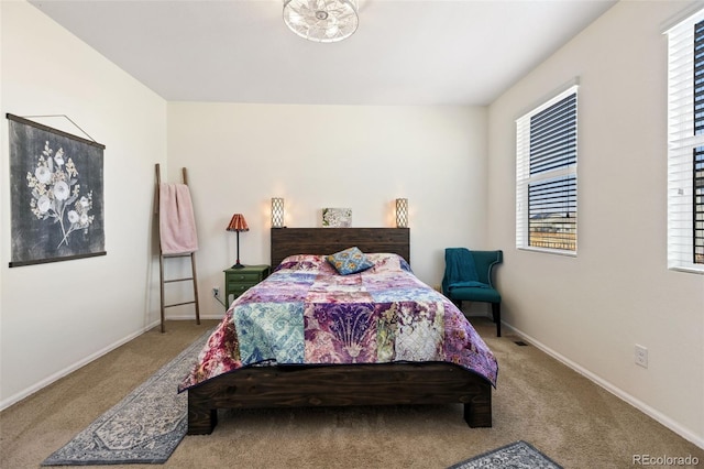 carpeted bedroom with baseboards