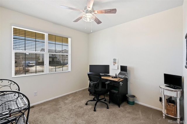 home office with baseboards, carpet, and a ceiling fan