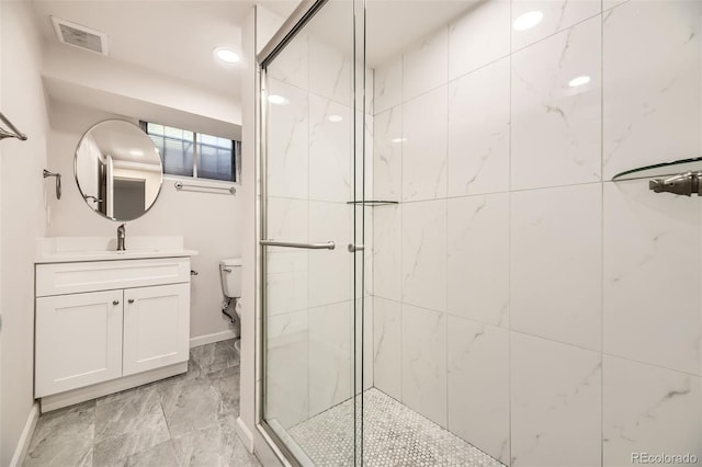 bathroom with a shower stall and baseboards