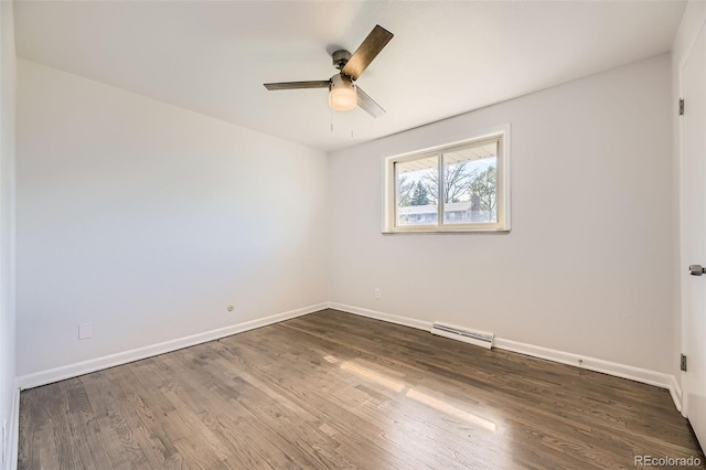 unfurnished room featuring baseboards, ceiling fan, and dark wood-type flooring