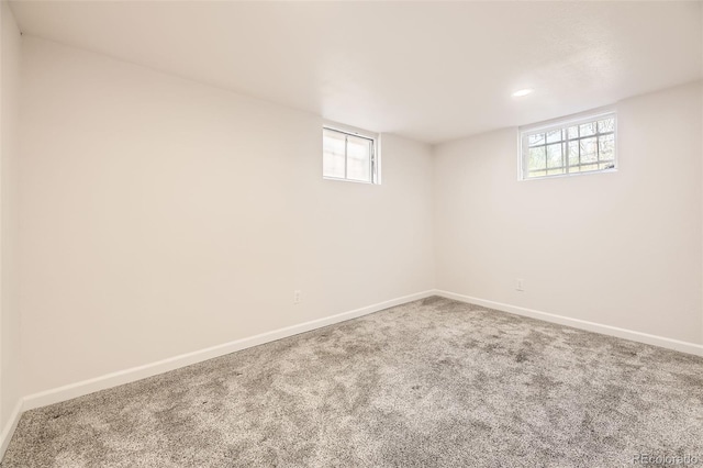 basement with baseboards, carpet floors, and recessed lighting