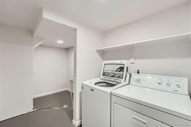 1926 S Yates St, Denver, CO 80219 - washroom featuring washing machine and clothes dryer and baseboards