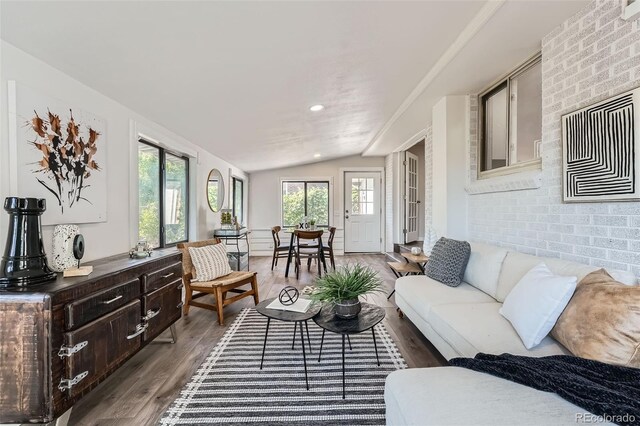 1926 S Yates St, Denver, CO 80219 - living room featuring vaulted ceiling and wood finished floors