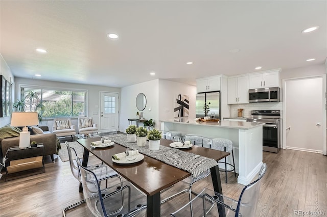 1926 S Yates St, Denver, CO 80219 - dining space with recessed lighting and light wood-style floors