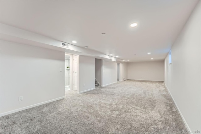 1926 S Yates St, Denver, CO 80219 - finished below grade area featuring light carpet, recessed lighting, and stairway