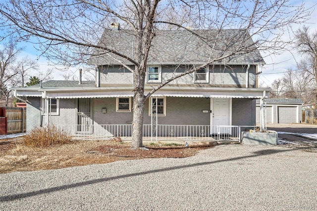 front facade featuring an outbuilding and a garage