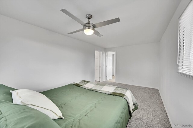 bedroom featuring ceiling fan and carpet