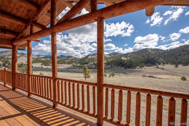 wooden deck with a mountain view