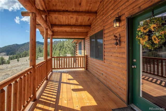 wooden terrace with a mountain view