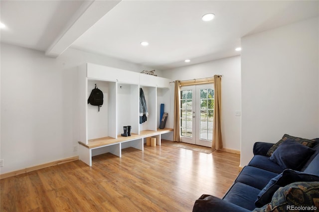 mudroom with light wood finished floors, recessed lighting, beamed ceiling, baseboards, and french doors