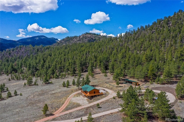 mountain view featuring a heavily wooded area