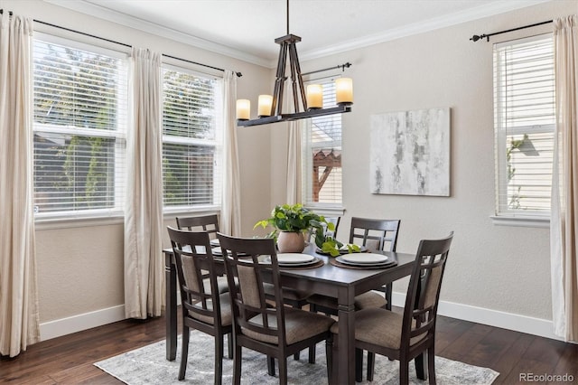 2857 Xanthia Ct, Denver, CO 80238 - dining room featuring dark wood-style flooring, baseboards, crown molding, and a chandelier