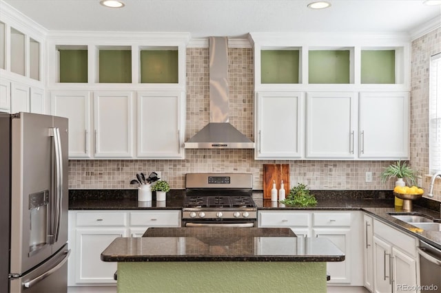 2857 Xanthia Ct, Denver, CO 80238 - kitchen with appliances with stainless steel finishes, wall chimney exhaust hood, a sink, white cabinetry, and ornamental molding