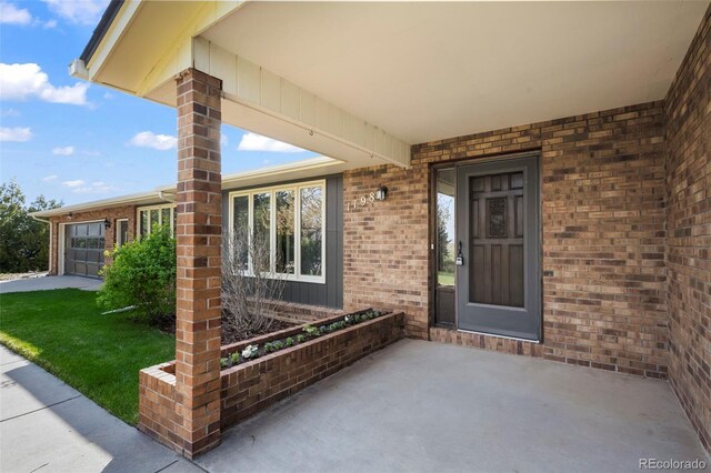 1198 Crestmoor Dr, Boulder, CO 80303 - view of exterior entry featuring brick siding