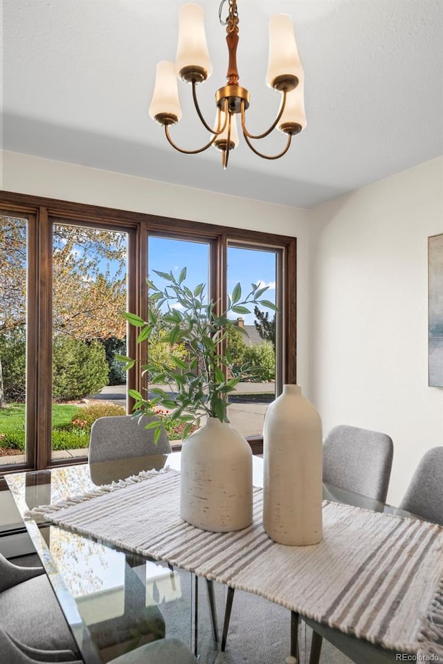1198 Crestmoor Dr, Boulder, CO 80303 - dining room featuring a chandelier and plenty of natural light