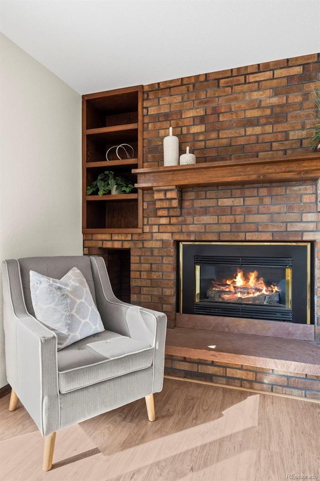 1198 Crestmoor Dr, Boulder, CO 80303 - sitting room with wood finished floors, a fireplace, and built in features