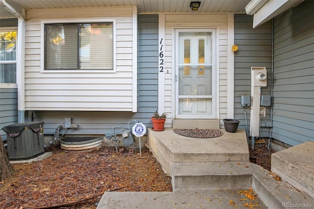 doorway to property featuring cooling unit