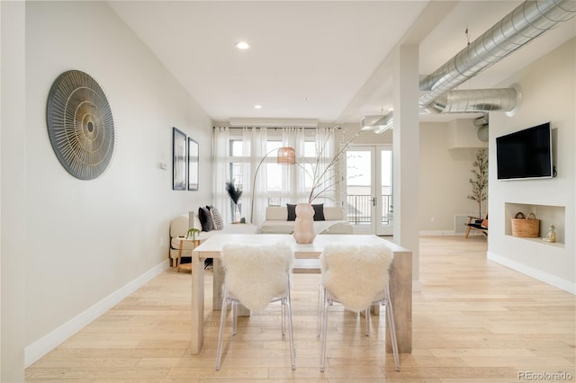 3198 Blake St Unit 402, Denver, CO 80205 - dining room with light wood-style flooring and recessed lighting