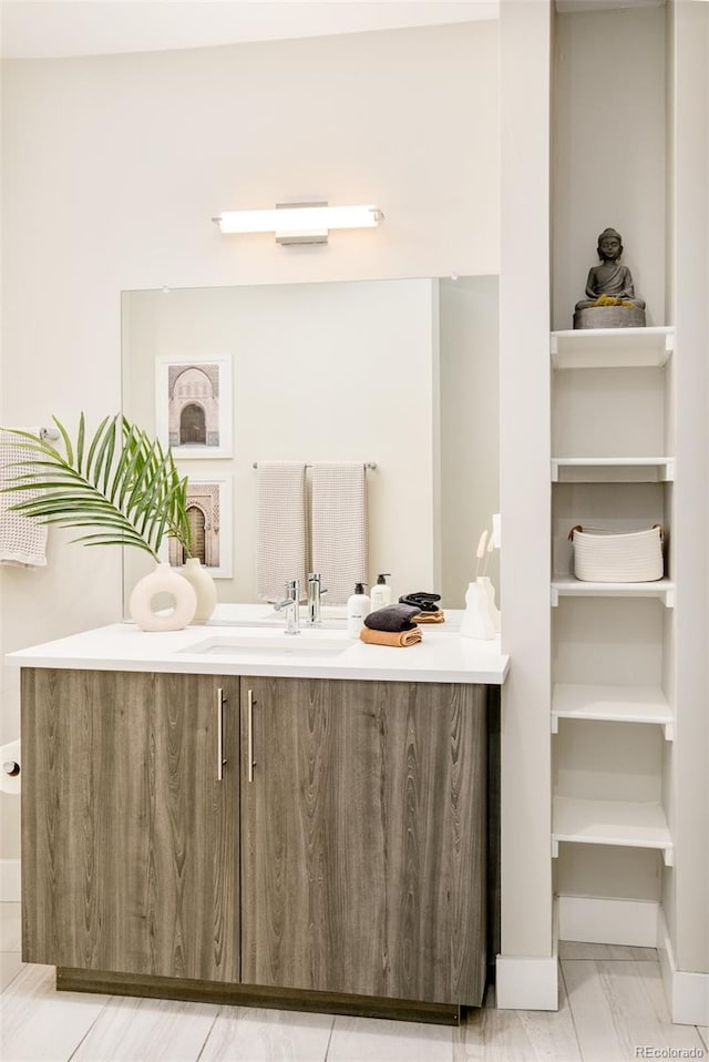 3198 Blake St Unit 402, Denver, CO 80205 - bathroom featuring vanity and baseboards