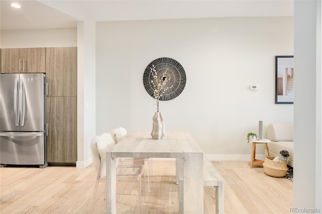 3198 Blake St Unit 402, Denver, CO 80205 - dining area featuring light wood-type flooring and recessed lighting