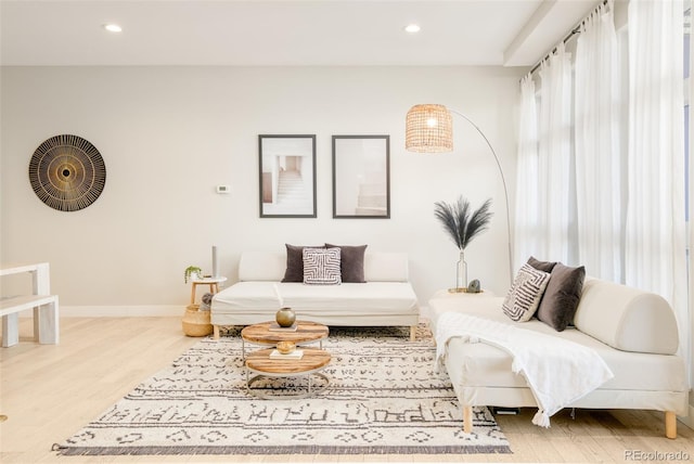 3198 Blake St Unit 402, Denver, CO 80205 - living area featuring wood finished floors and recessed lighting