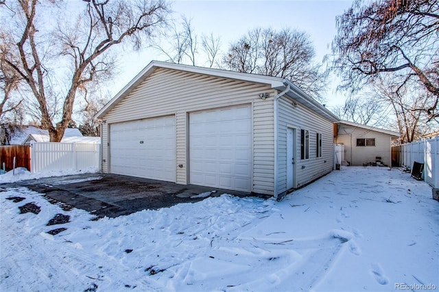 view of snow covered garage