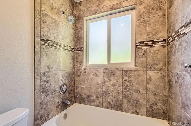 4111 S Delaware St, Englewood, CO 80110 - full bathroom featuring a textured wall and bathtub / shower combination
