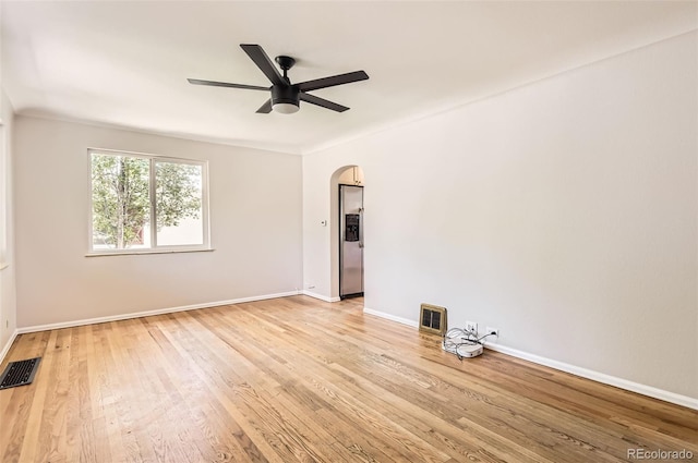 4111 S Delaware St, Englewood, CO 80110 - spare room with arched walkways, light wood-type flooring, and a ceiling fan