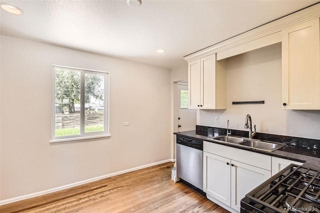 4111 S Delaware St, Englewood, CO 80110 - kitchen with dishwasher, light wood finished floors, recessed lighting, range with gas cooktop, and white cabinetry