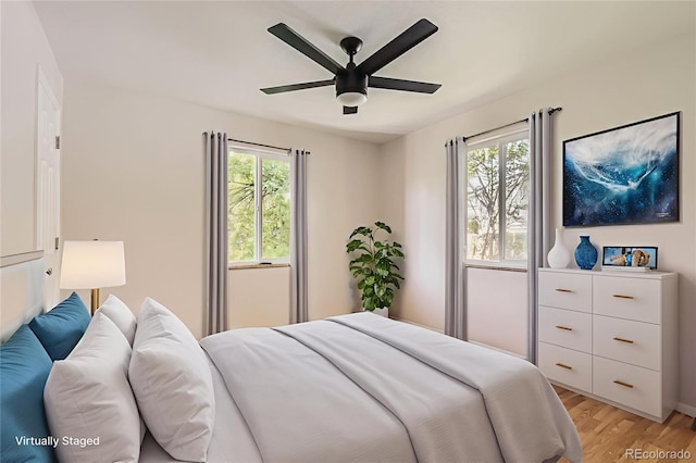 4111 S Delaware St, Englewood, CO 80110 - bedroom with multiple windows, light wood-style floors, and a ceiling fan