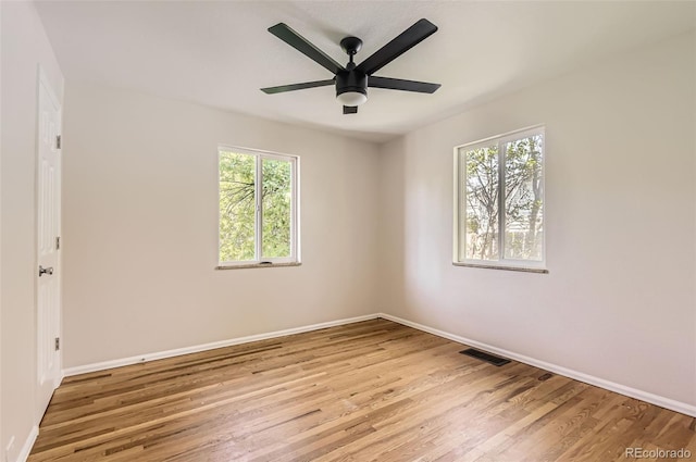 4111 S Delaware St, Englewood, CO 80110 - unfurnished room featuring plenty of natural light, wood finished floors, and ceiling fan