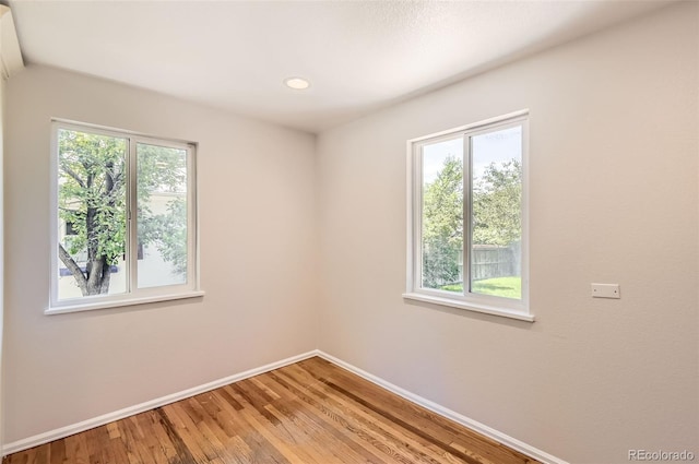 4111 S Delaware St, Englewood, CO 80110 - empty room featuring healthy amount of natural light, light wood-style floors, and recessed lighting