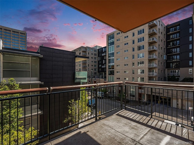 view of balcony at dusk