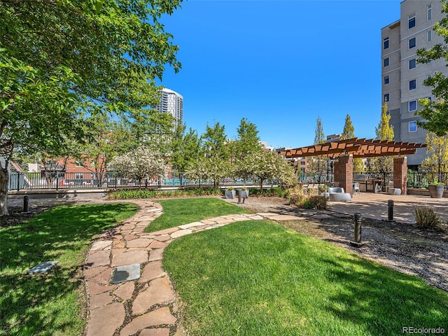 surrounding community with a pergola and a lawn